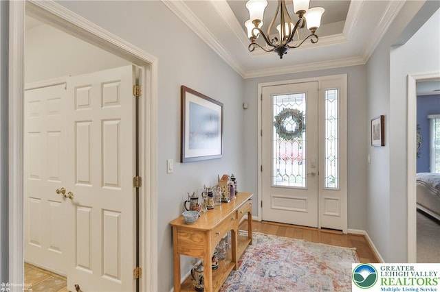 4076 Pine Hurst Dr, Allen Twp, PA 18067 - foyer entrance with a chandelier, light wood-style floors, ornamental molding, and a tray ceiling