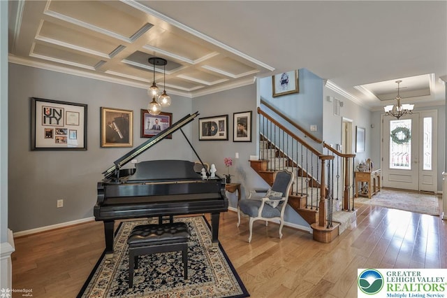 4076 Pine Hurst Dr, Allen Twp, PA 18067 - entryway featuring ornamental molding, a chandelier, stairway, wood finished floors, and coffered ceiling