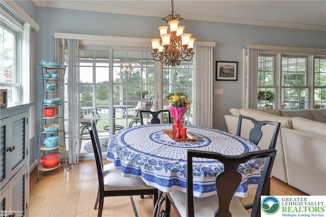 4076 Pine Hurst Dr, Allen Twp, PA 18067 - dining space featuring a chandelier, healthy amount of natural light, ornamental molding, and light wood-type flooring