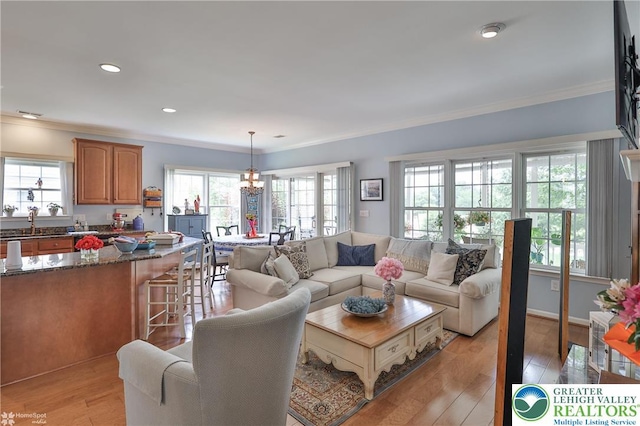 4076 Pine Hurst Dr, Allen Twp, PA 18067 - living area with ornamental molding, plenty of natural light, light wood-type flooring, and recessed lighting