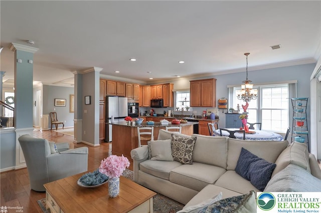 4076 Pine Hurst Dr, Allen Twp, PA 18067 - living room featuring crown molding, light wood-style flooring, recessed lighting, and a chandelier