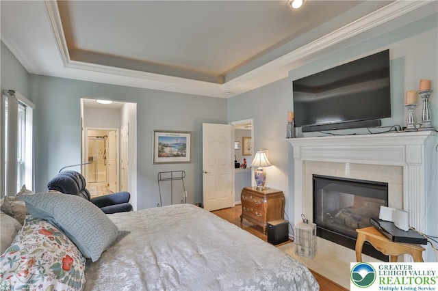 4076 Pine Hurst Dr, Allen Twp, PA 18067 - bedroom with a raised ceiling, a high end fireplace, wood finished floors, and ensuite bathroom