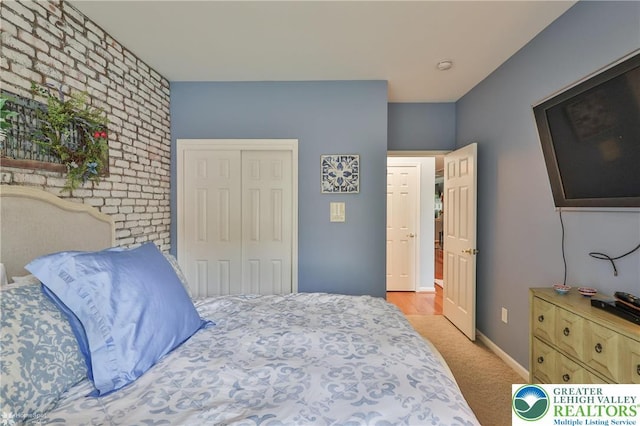 4076 Pine Hurst Dr, Allen Twp, PA 18067 - bedroom featuring a closet, light carpet, and brick wall