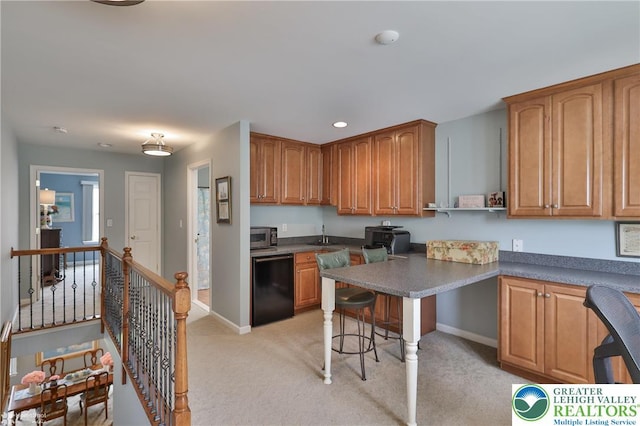 4076 Pine Hurst Dr, Allen Twp, PA 18067 - kitchen featuring stainless steel microwave, black dishwasher, light carpet, brown cabinetry, and recessed lighting