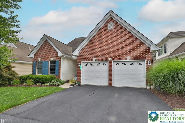 4076 Pine Hurst Dr, Allen Twp, PA 18067 - traditional-style home with brick siding, asphalt driveway, a front lawn, and an attached garage