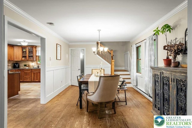 1079 Marshalls Creek Rd, Middle Smithfield Twp, PA 18302 - dining room featuring a chandelier, light wood-style floors, stairway, a baseboard radiator, and ornamental molding
