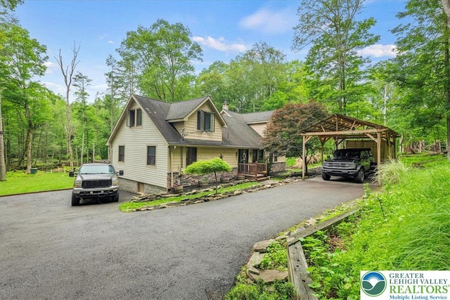 1079 Marshalls Creek Rd, Middle Smithfield Twp, PA 18302 - view of front of house with a carport, driveway, and a chimney