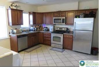 732 Washington Ave, Northampton Boro, PA 18067 - kitchen with stainless steel appliances and light tile patterned floors