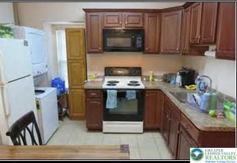 732 Washington Ave, Northampton Boro, PA 18067 - kitchen featuring white appliances, light countertops, and light tile patterned flooring
