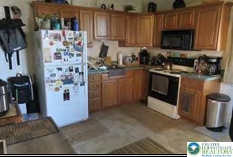 732 Washington Ave, Northampton Boro, PA 18067 - kitchen with white appliances and brown cabinets