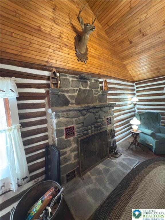 521 Resica Falls Rd, East Stroudsburg, PA 18302 - living area featuring wood ceiling, rustic walls, a fireplace, stone finish floors, and high vaulted ceiling