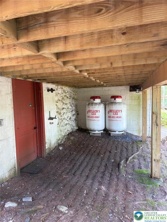 521 Resica Falls Rd, East Stroudsburg, PA 18302 - exterior view of gas tank and concrete block siding