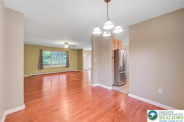 119 Savage Trl, Smithfield Twp, PA 18301 - spare room featuring a baseboard heating unit, light wood finished floors, a chandelier, and ceiling fan