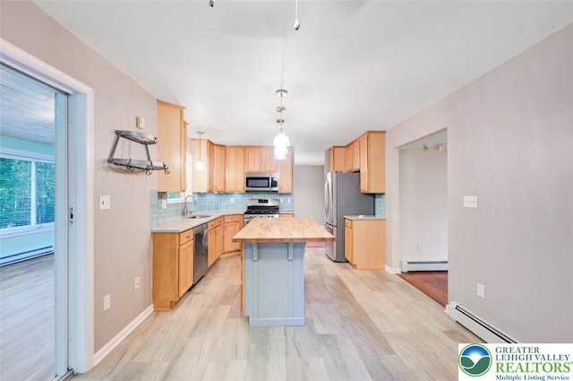 119 Savage Trl, Smithfield Twp, PA 18301 - kitchen with appliances with stainless steel finishes, a baseboard radiator, backsplash, and light brown cabinets