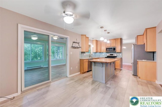 119 Savage Trl, Smithfield Twp, PA 18301 - kitchen featuring stainless steel appliances, a center island, backsplash, ceiling fan, and wooden counters