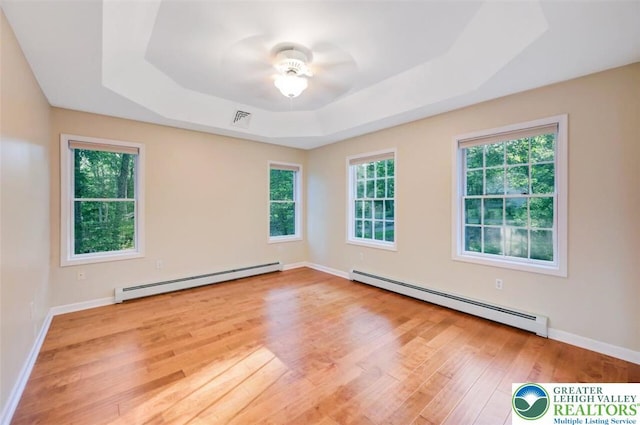 119 Savage Trl, Smithfield Twp, PA 18301 - empty room featuring baseboard heating, wood finished floors, and plenty of natural light