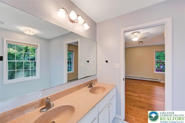 119 Savage Trl, Smithfield Twp, PA 18301 - full bathroom with a baseboard heating unit and double vanity