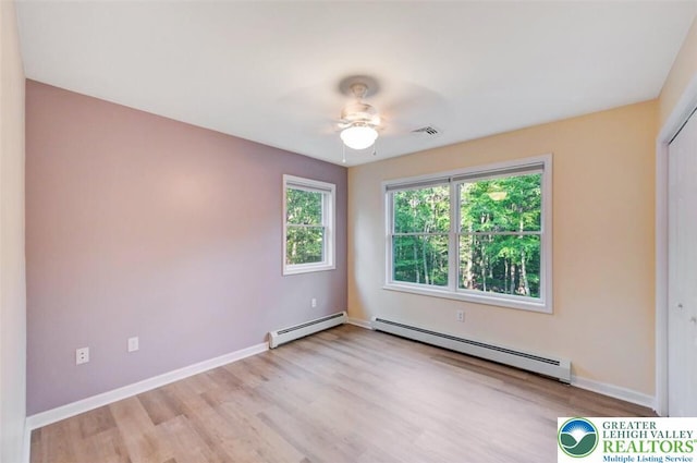 119 Savage Trl, Smithfield Twp, PA 18301 - unfurnished room featuring a baseboard radiator, light wood-style floors, and a ceiling fan