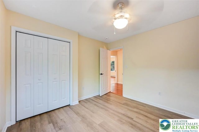 119 Savage Trl, Smithfield Twp, PA 18301 - unfurnished bedroom featuring wood finished floors, a closet, and ceiling fan