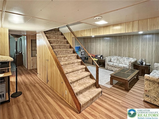 7537 Lake Shore Dr, Tobyhanna Twp, PA 18347 - finished below grade area featuring wood walls, stairway, and light wood-type flooring