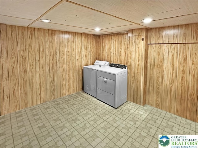 7537 Lake Shore Dr, Tobyhanna Twp, PA 18347 - laundry room with independent washer and dryer, tile patterned floors, and wooden walls
