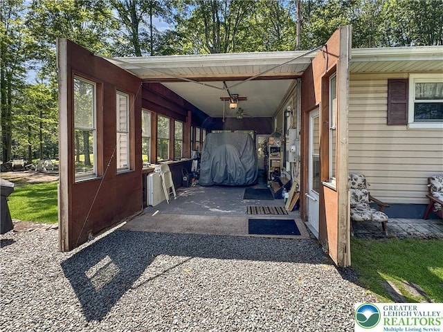 7537 Lake Shore Dr, Tobyhanna Twp, PA 18347 - view of vehicle parking featuring a ceiling fan and an attached carport