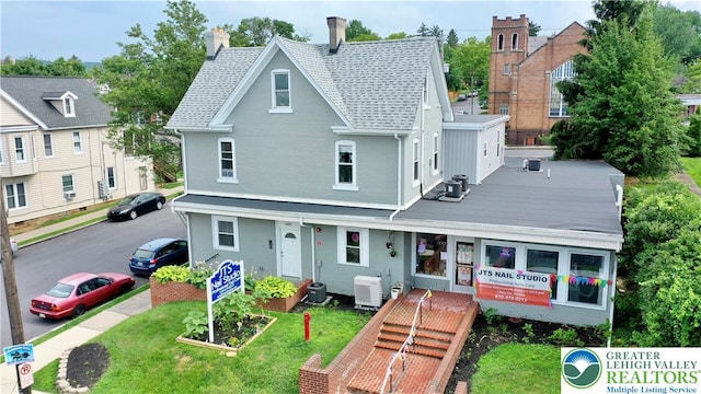 801 W Broad, Bethlehem City, PA 18018 - view of front of property with a chimney, a front lawn, and a shingled roof
