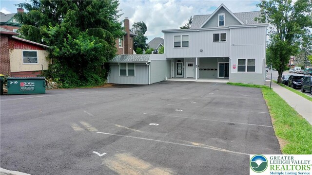 801 W Broad, Bethlehem City, PA 18018 - view of front facade featuring uncovered parking and roof with shingles