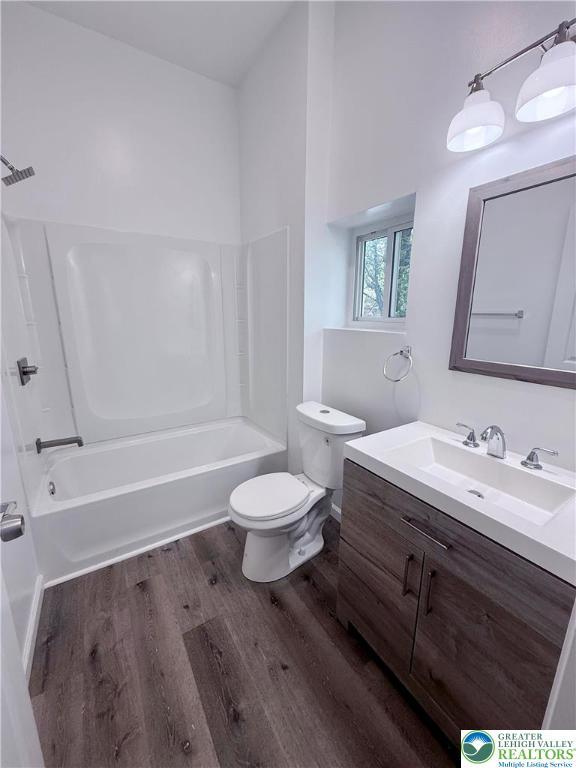 801 W Broad, Bethlehem City, PA 18018 - full bathroom with wood finished floors, vanity, and bathtub / shower combination