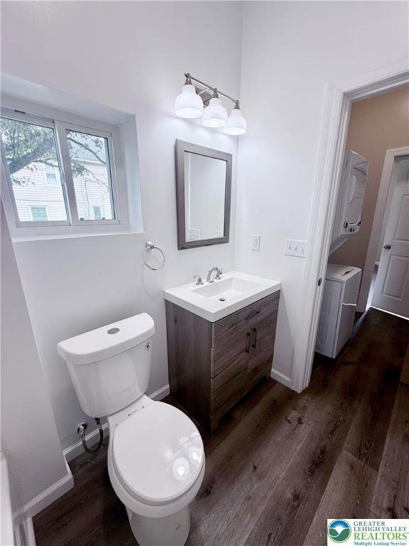 801 W Broad, Bethlehem City, PA 18018 - half bath featuring vanity, wood finished floors, and washer / clothes dryer