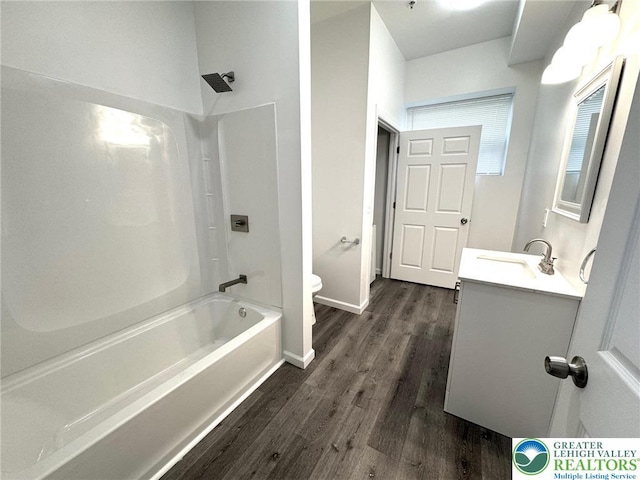 801 W Broad, Bethlehem City, PA 18018 - bathroom featuring vanity, wood finished floors, and washtub / shower combination