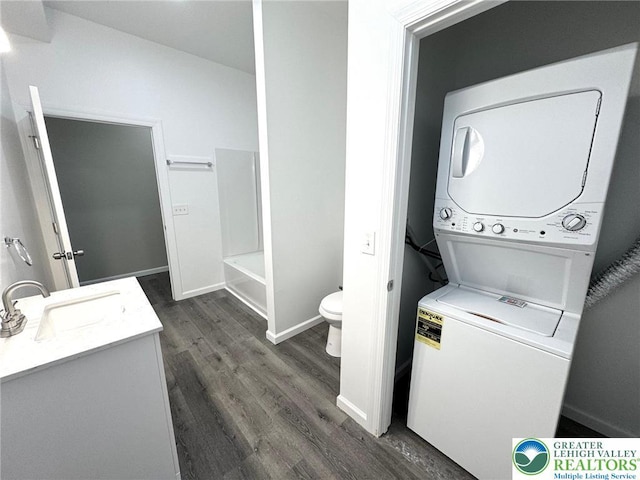 801 W Broad, Bethlehem City, PA 18018 - laundry area with stacked washer / dryer and dark wood-style floors