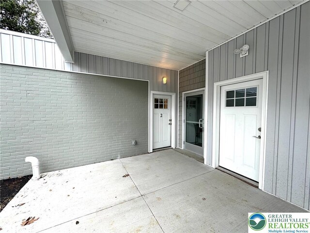 801 W Broad, Bethlehem City, PA 18018 - entrance to property with a patio area, brick siding, and board and batten siding