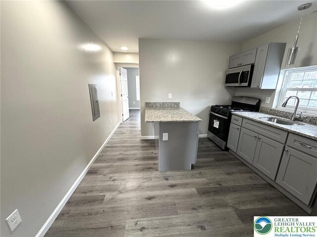 801 W Broad, Bethlehem City, PA 18018 - kitchen with stainless steel appliances, gray cabinetry, wood finished floors, and light stone counters