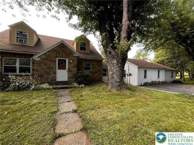 5984 Rte 412, Springfield Twp, PA 18077 - view of front of home featuring stone siding, a front lawn, and a shingled roof
