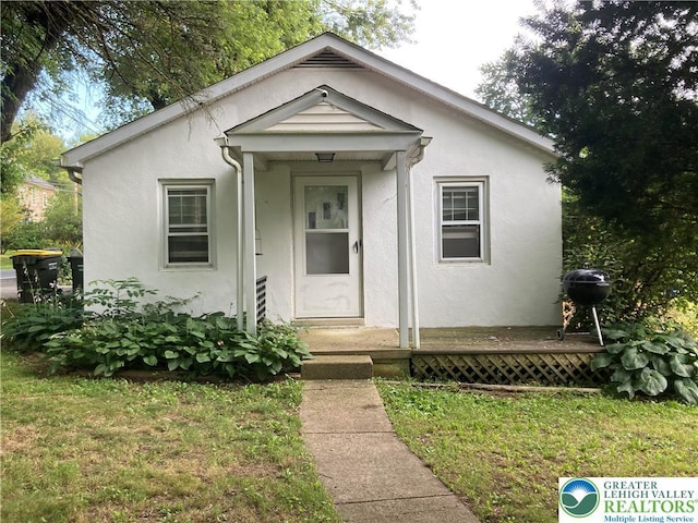 5984 Rte 412, Springfield Twp, PA 18077 - view of front of home with stucco siding and a front lawn