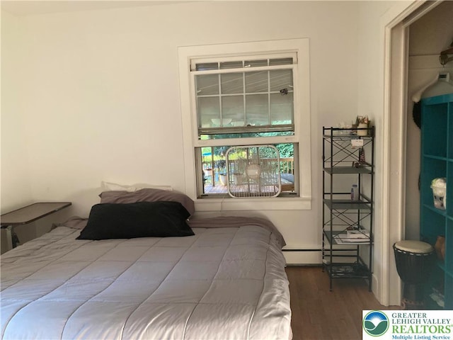 5984 Rte 412, Springfield Twp, PA 18077 - bedroom featuring wood finished floors and a baseboard radiator