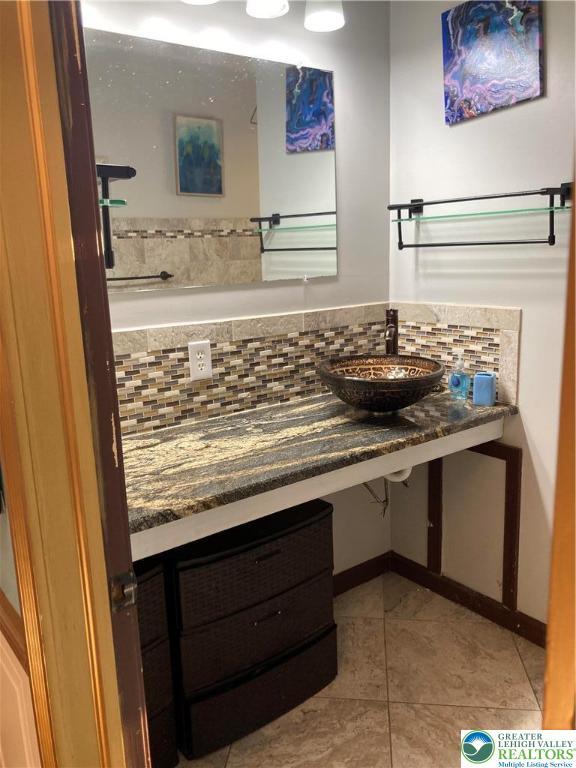 5984 Rte 412, Springfield Twp, PA 18077 - bathroom with decorative backsplash, tile patterned flooring, and vanity