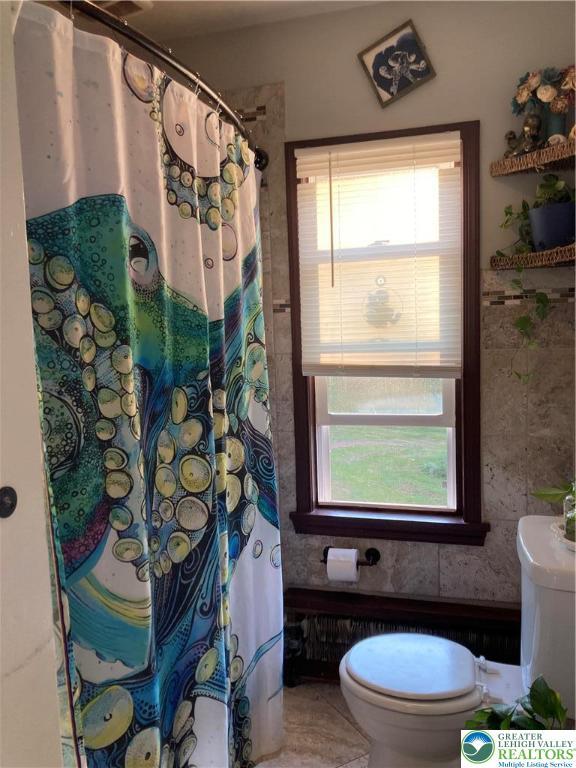 5984 Rte 412, Springfield Twp, PA 18077 - bathroom featuring toilet and a shower with shower curtain