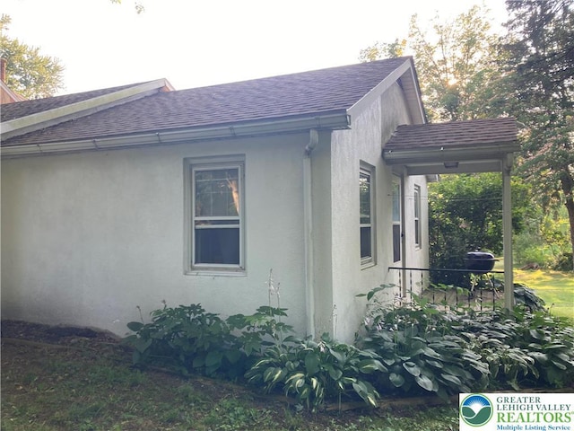 5984 Rte 412, Springfield Twp, PA 18077 - view of side of home with roof with shingles and stucco siding