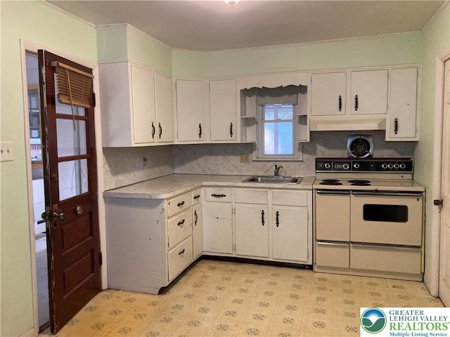 5984 Rte 412, Springfield Twp, PA 18077 - kitchen with white range with electric stovetop, light countertops, under cabinet range hood, light flooring, and ornamental molding