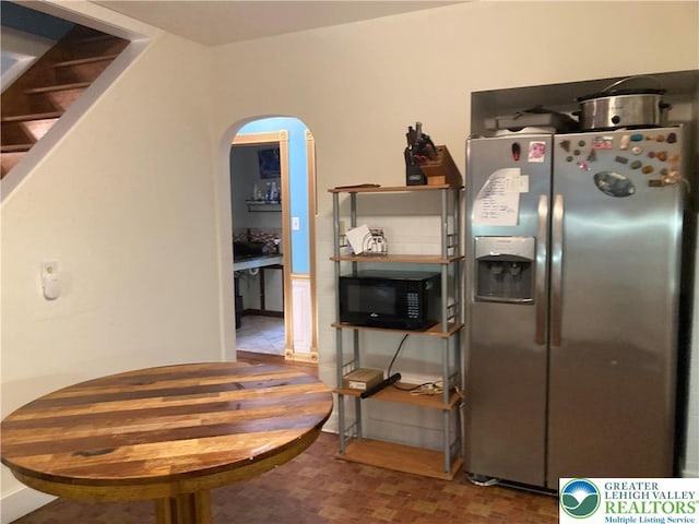 5984 Rte 412, Springfield Twp, PA 18077 - kitchen with stainless steel refrigerator with ice dispenser, black microwave, and arched walkways