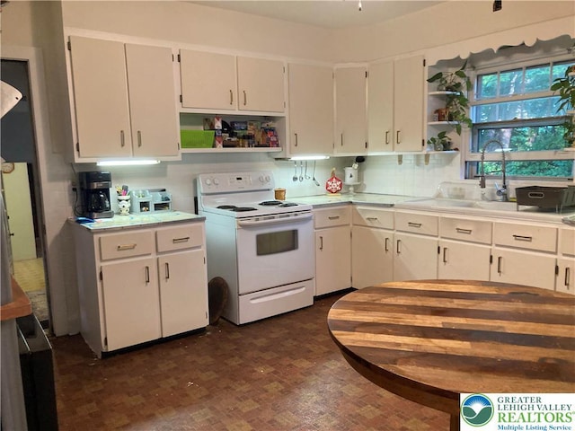 5984 Rte 412, Springfield Twp, PA 18077 - kitchen featuring white range with electric stovetop, open shelves, light countertops, and white cabinetry