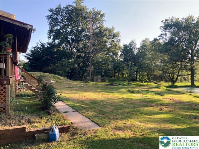5984 Rte 412, Springfield Twp, PA 18077 - view of grassy yard with stairway and view of scattered trees