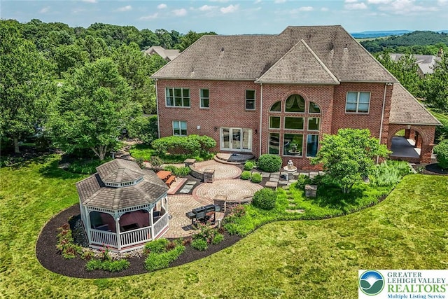 4260 W Wyndemere Cir, Lowhill Twp, PA 18078 - rear view of house featuring a gazebo, a patio area, brick siding, a yard, and french doors