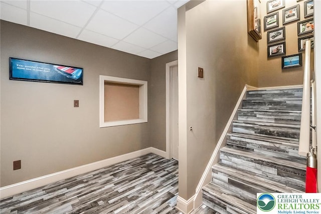4260 W Wyndemere Cir, Lowhill Twp, PA 18078 - stairs featuring wood finished floors and a paneled ceiling