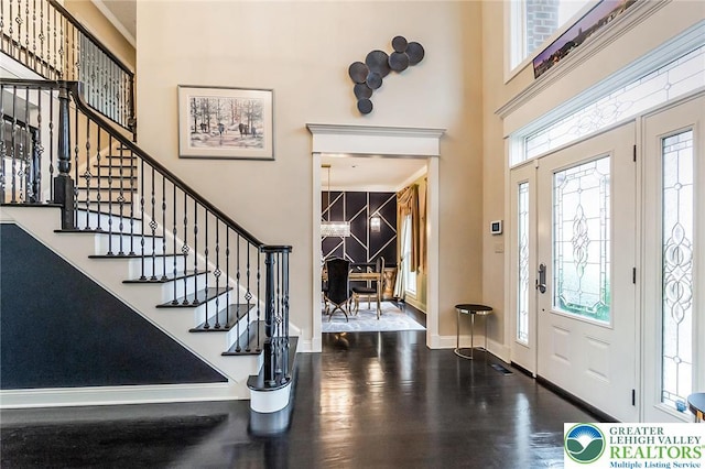 4260 W Wyndemere Cir, Lowhill Twp, PA 18078 - entrance foyer featuring a high ceiling, stairway, and wood finished floors