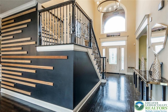 4260 W Wyndemere Cir, Lowhill Twp, PA 18078 - foyer with wood finished floors, plenty of natural light, a towering ceiling, stairway, and a chandelier