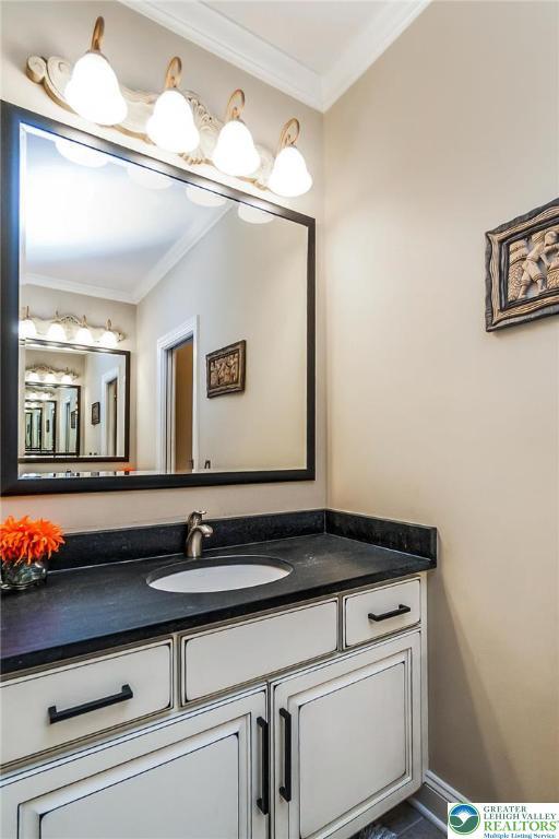 4260 W Wyndemere Cir, Lowhill Twp, PA 18078 - bathroom with ornamental molding and vanity