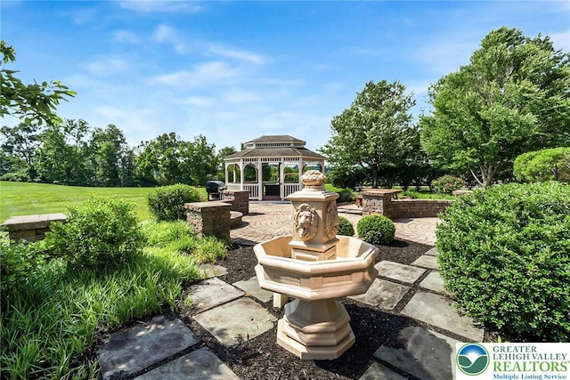 4260 W Wyndemere Cir, Lowhill Twp, PA 18078 - view of patio featuring a gazebo, view of wooded area, and grilling area